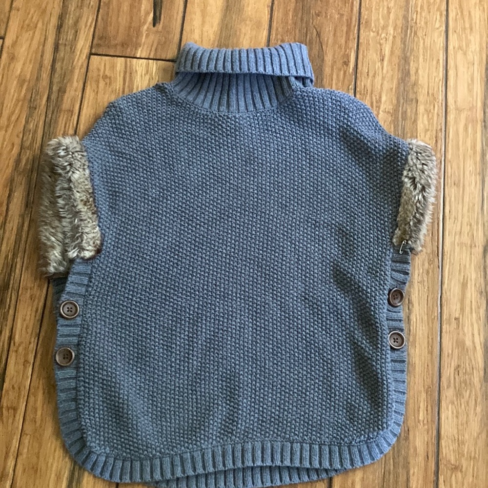 I am selling a gray sweater that is a turtleneck. The size is 10-12